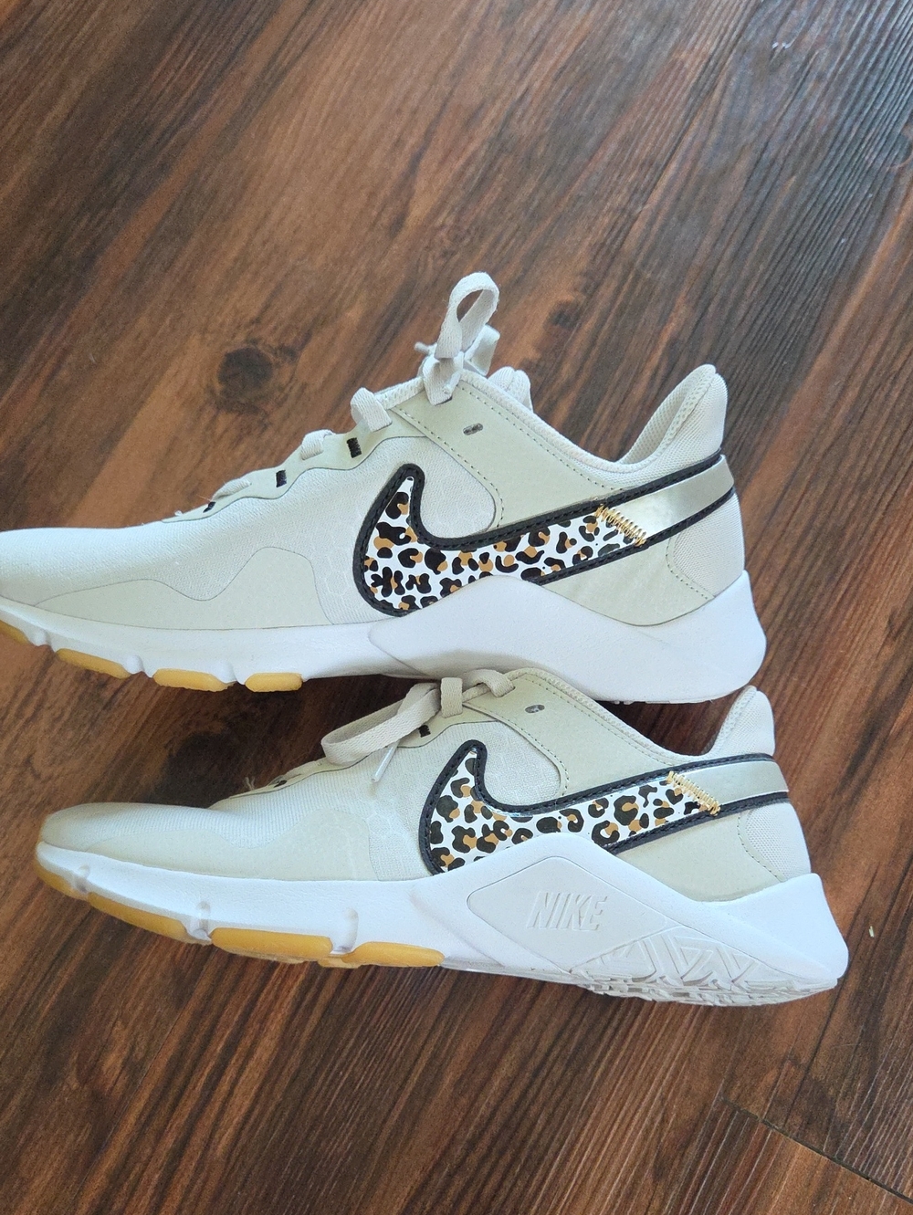 Nike Women’s Cream Sneakers with Leopard Swoosh and Black Trim